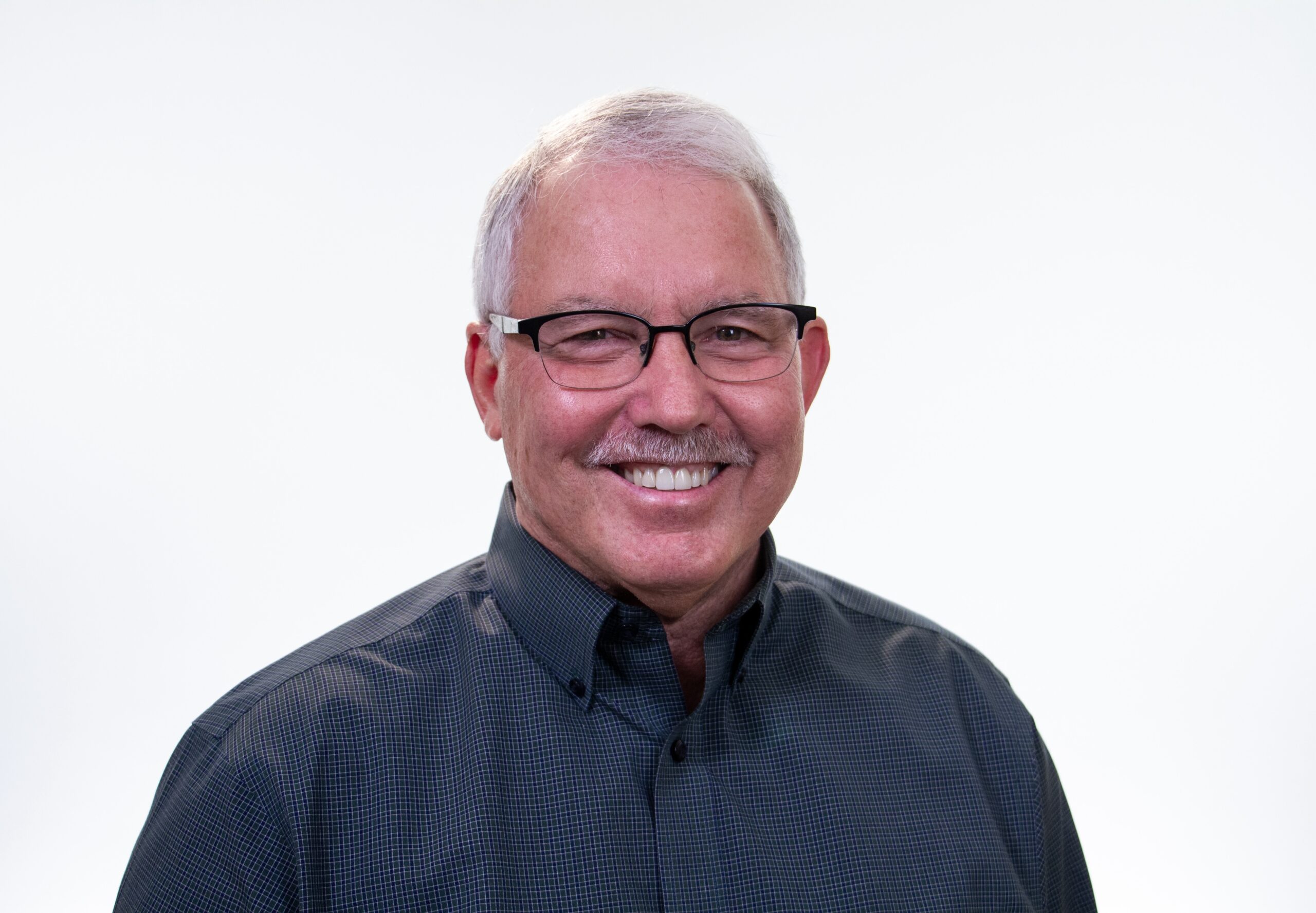 Headshot photo of Dr. John Trent