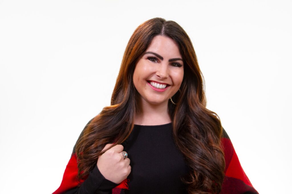 picture of Kari Trent Stageberg smiling with a red and black jacket and white background